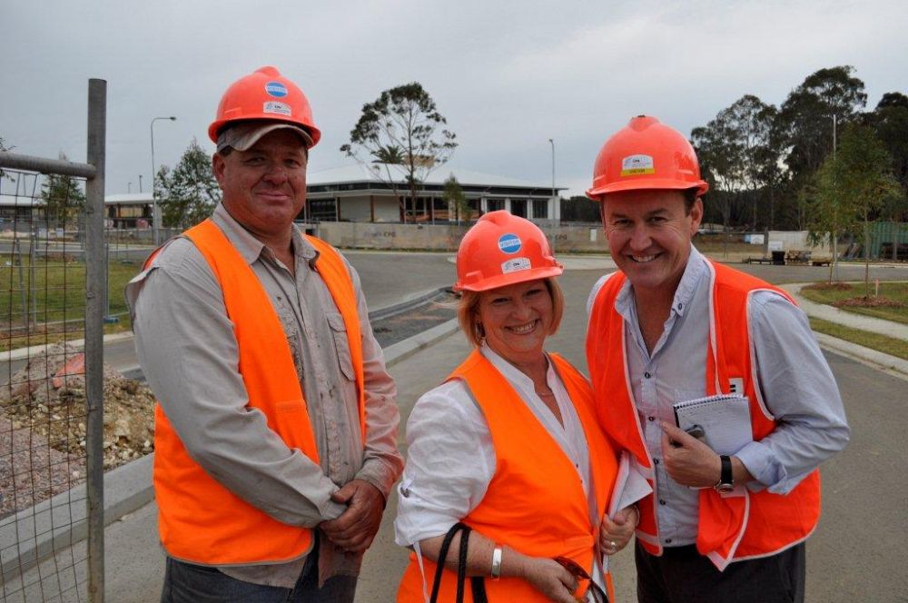 Hard hats, safety jackets and happy smiles all round